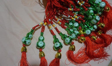 Accrochage en calebasse vert (3,00 x 5,00 cm)