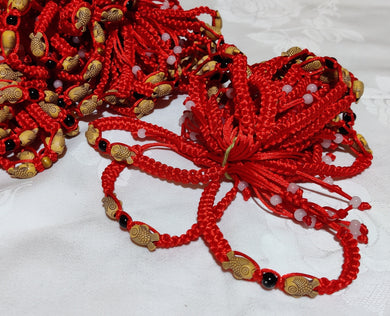 Bracelet fil rouge avec poisson