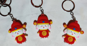 Porte-clés poupée chinoise rouge en caoutchouc (3.50 x 5.00 cm)