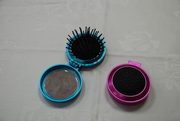 Peigne avec miroir pliable