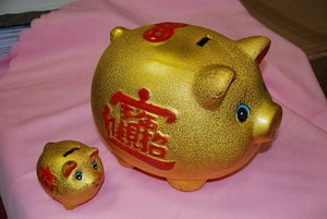 Tire-lire de cochon doré en porcelaine (12 x 17 cm)